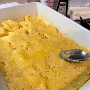 press cake base to cover pan